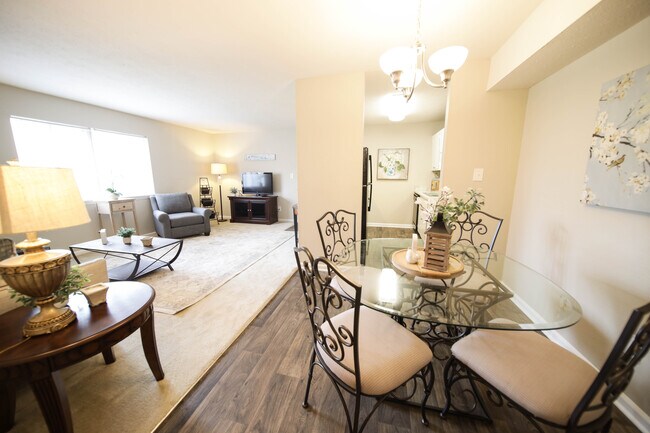 Spacious, landscaped outdoor terrace with lush seating, grills and a fire pit