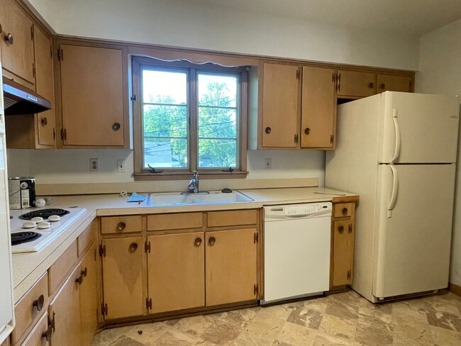 Photo - {731} Convenient Location + Full basement + 2 Car Tandem Garage