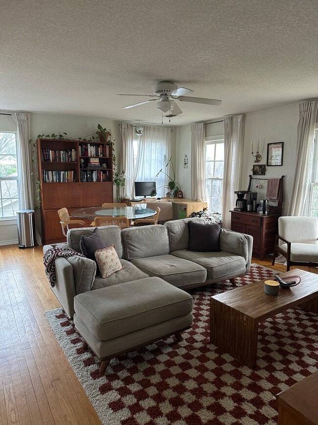Living room. Windows on the right face the street 940-383-2500 - 2019 N Bell Ave Unit B