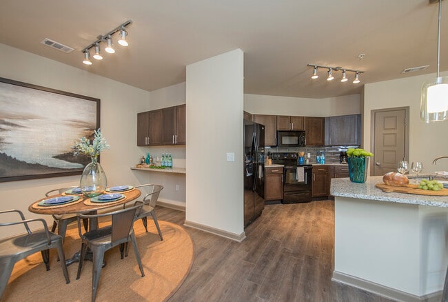 Spacious Dining Room with Work Area and View into Large Open Kitchen | Apartments in Nashville | 909 Flats - 909 Flats Apartments