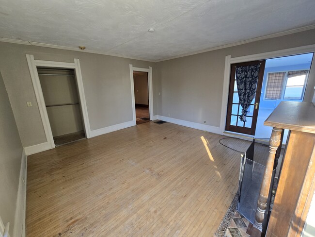 Beautiful wood floors front room, facing the street - 404 W Wisconsin Ave Apartments Unit 1st floor