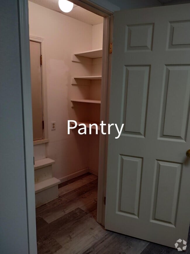Kitchen has pantry along with a closet that can be use as more storage. - 6588 Log Cabin Ln Unit Apartment