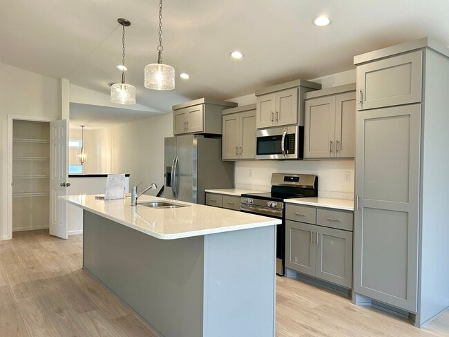 Photo - Spacious & Stylish 4-Bed Home with Modern Finishes and Attached 2-Stall Garage