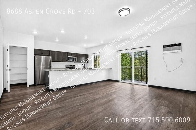 Building Photo - 8688 Aspen Ln Unit 703