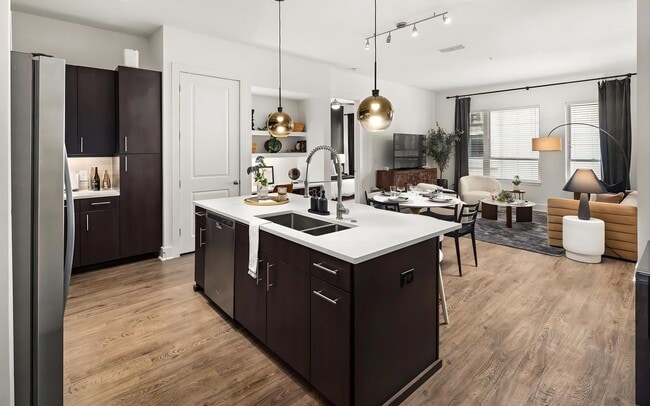 Apartment Kitchen and Living Area With Wood Flooring and Dining Setup