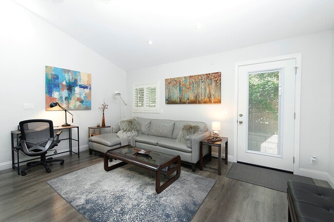 TV seating area next to a Dedicated Workstation - 73 Summerfield St Unit 805 Modern and Private