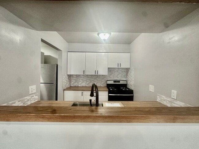 Photo - Open-Concept 3BR Condo with Finished Basement in Canton