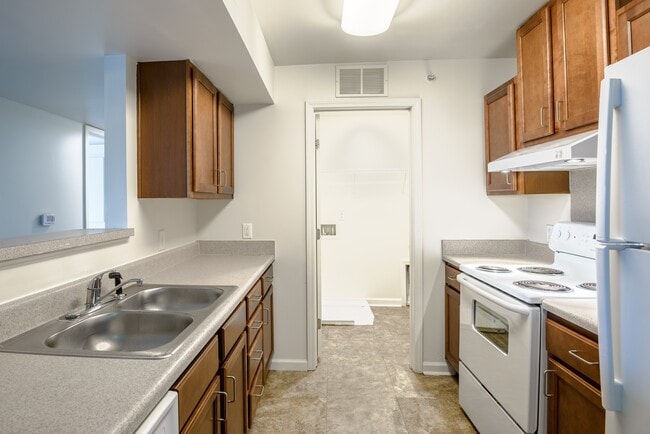 Cook with confidence in a well-equipped kitchen featuring generous counter space and abundant cabinet storage.
