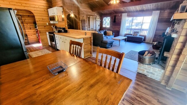 Photo - Move-In Ready 2-Bedroom Log Home with Wrap-Around Deck and Enclosed Yard