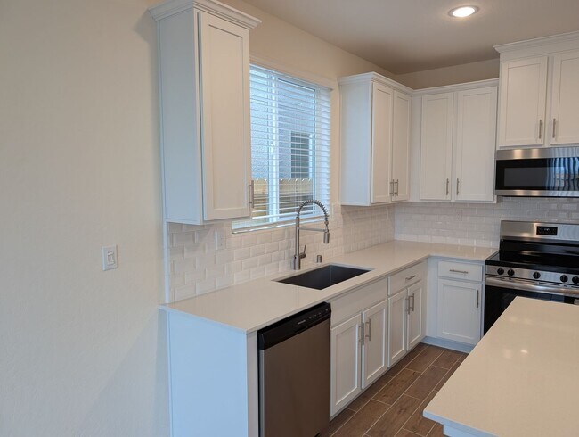 Photo - New Wilson home offering modern amenities, solar and a nice floor plan. Bonus room with den or of...