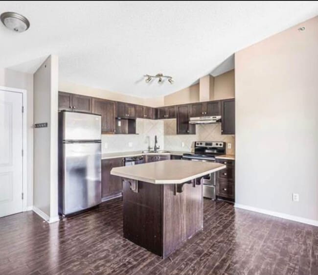 Building Photo - 9357 Simpson Dr NW Unit 4201