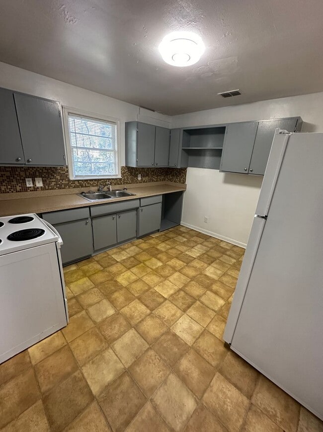 Photo - 3 bedroom 1 bath house with a large back yard! Available August 2026