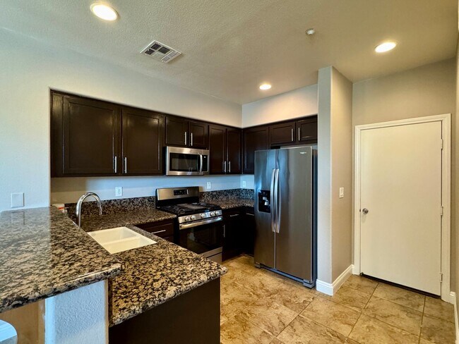 Photo - 3 Bed 2.5 Bath plus extra room Townhouse Style Condo / Attached 2 Car Garage