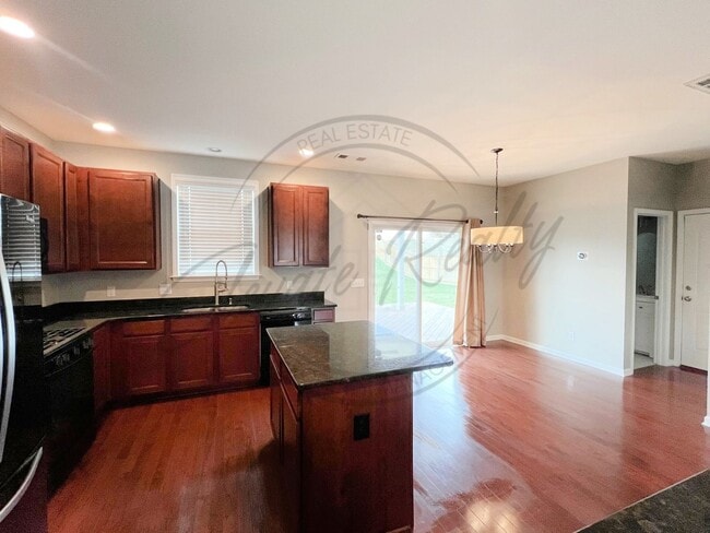 Photo - Three Bedroom, Fully Fenced Two Story with a Community Pool & Fitness Center!