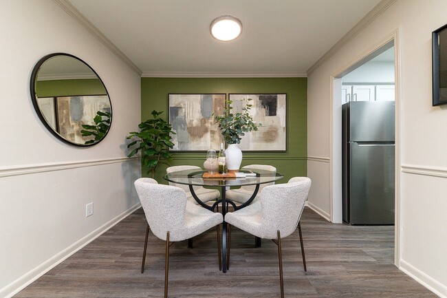 Dining area with hardwood-style flooring & overhead lighting
