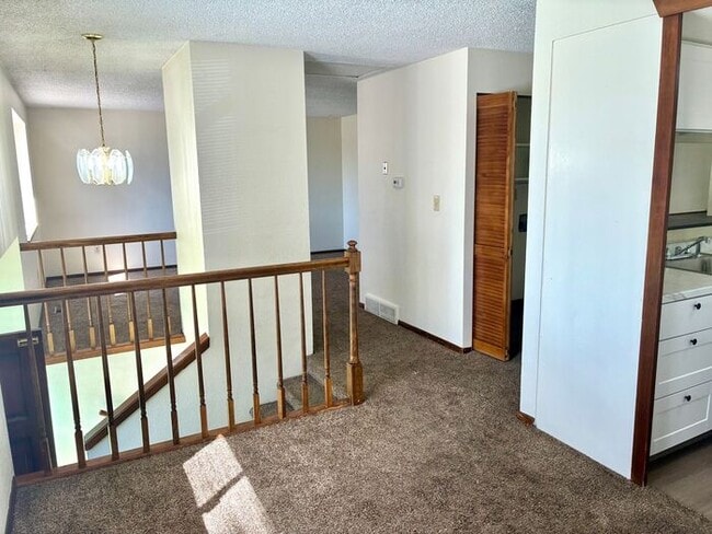 Building Photo - Great 2 Bedroom/1 Bath Duplex with 1 Car Attached Garage in Northeast Loveland, CO