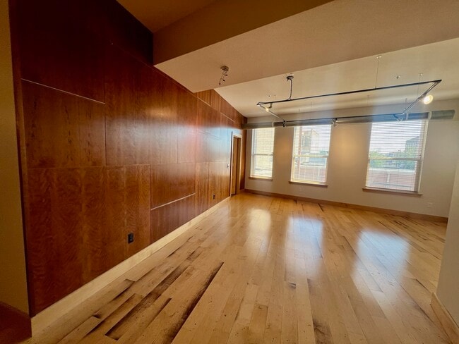 Open Living Space with West Facing Windows - 319 Broadway N Unit 205