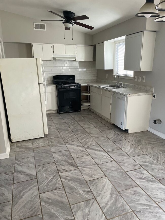 Photo - 3BR 1BA Home w/ Fenced Backyard & Patio • Stove-Ready Kitchen • Carport in Memphis