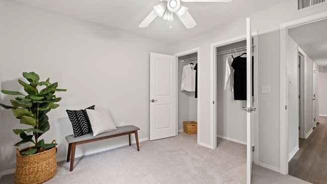 Spacious bedroom with cozy carpet and a roomy double closet – where style meets storage!