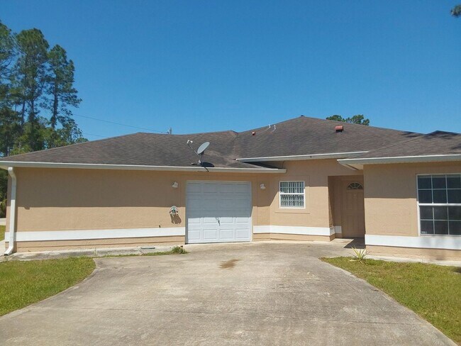 Photo - Great 3/2/1 duplex with a private driveway...