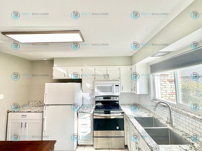 Photo - 2-bed, 2-bath, 2-story townhome with pool and park like setting outside the front door.