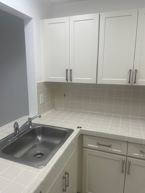 Renovated kitchen counter and new cabinets - 14851 SW 104th St Unit Heron at the Hammocks -21