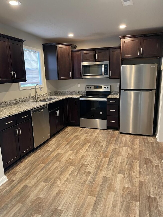 Photo - Modern Kitchen • Walk-In Closet • Private Primary Suite