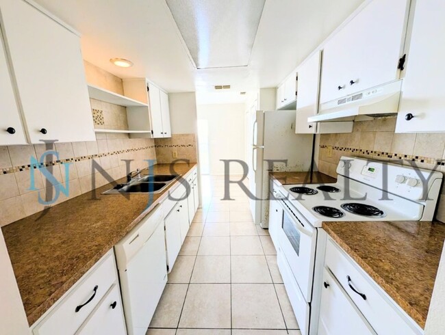 Photo - Beautifully updated 3/2/2 1500 Sq. Ft. with fenced yard, tile floors, HUGE living room and a corn...