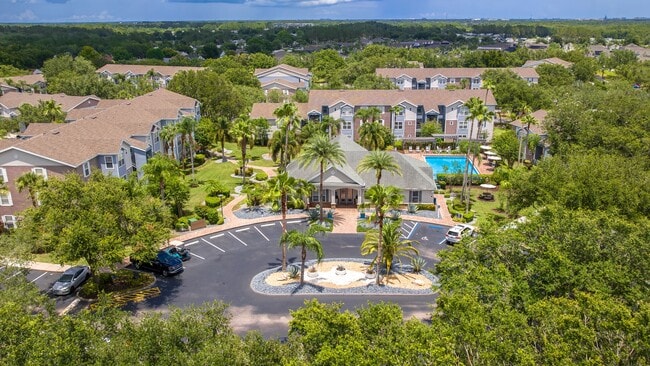Discover the lush, resort-style layout of Ashton Chase Apartments—featuring vibrant landscaping, a sparkling pool, and spacious apartment homes.
