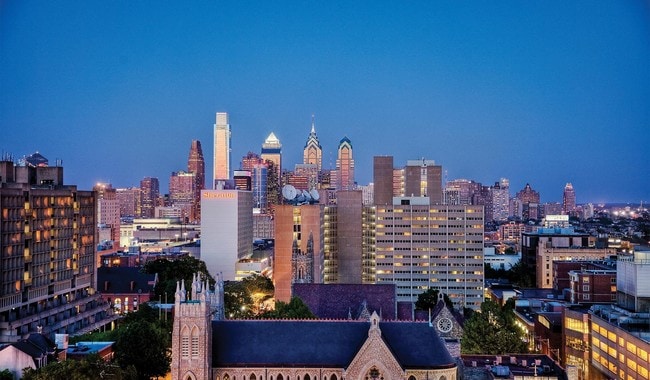 Some apartments include a bay window with a view of U-City and downtown Philly