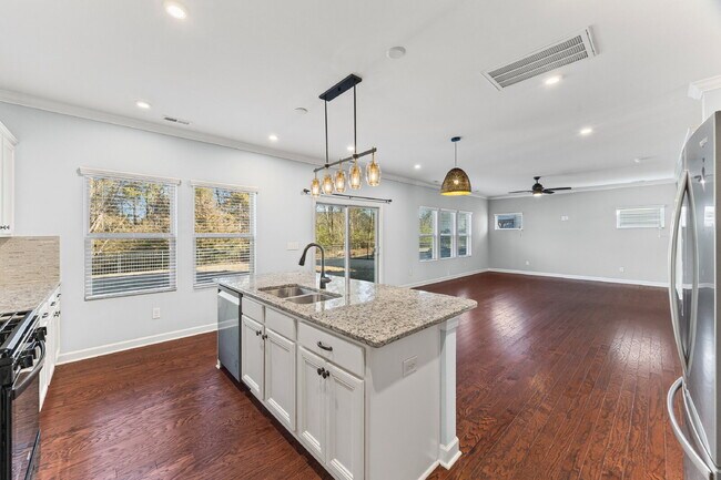 Photo - Classic finishes paired with an open, versatile layout!