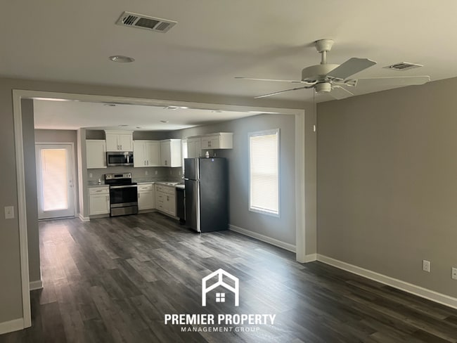 Photo - Spacious 4BR/2BA in Tuscaloosa | Hardwood Floors, 2-Car Garage & Covered Back Patio