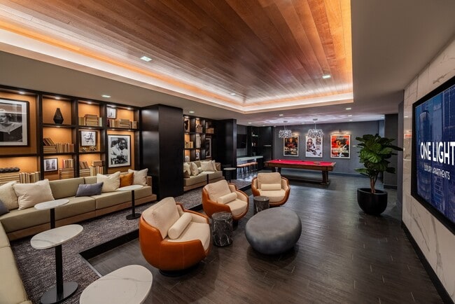 The refreshed theater and social room at One Light Luxury Apartments