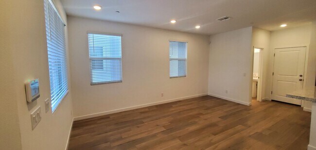 Photo - Contemporary townhome with modern exterior and attached garage.