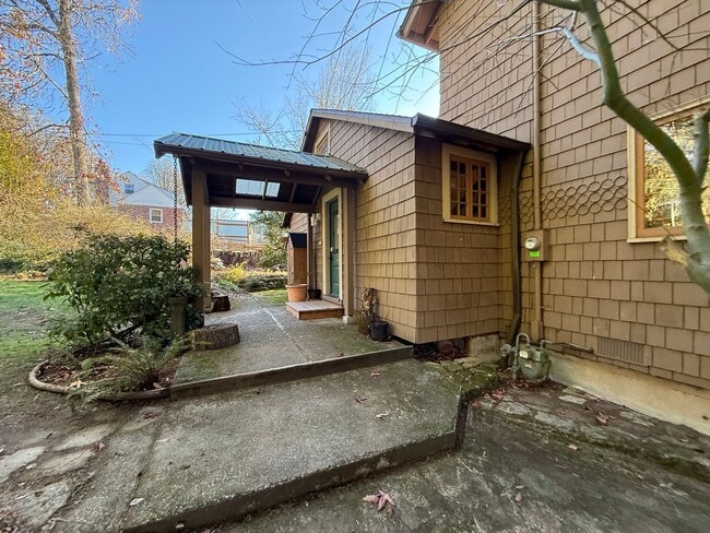 Photo - Vintage Urban Farmhouse 3 Bd 1 Bath home! Large bonus room & Balcony!  Surrounded by trees on lar...