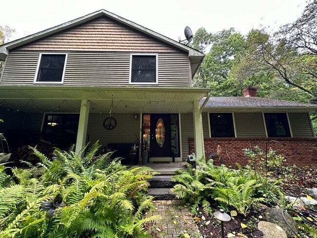 Building Photo - Dream Home in Highland, Michigan: Your Private Oasis on 5 Wooded Acres