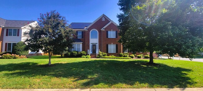Photo - Stately brick front contemporary on huge c...