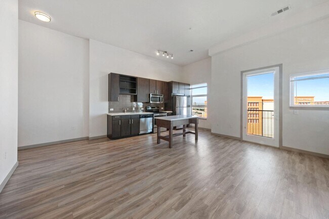 Large spacious living room with luxury vinyl plank flooring