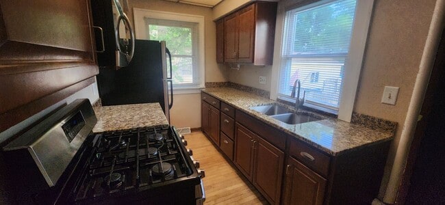 Photo - Fully fenced yard with stainless steel appliances including gas stove!