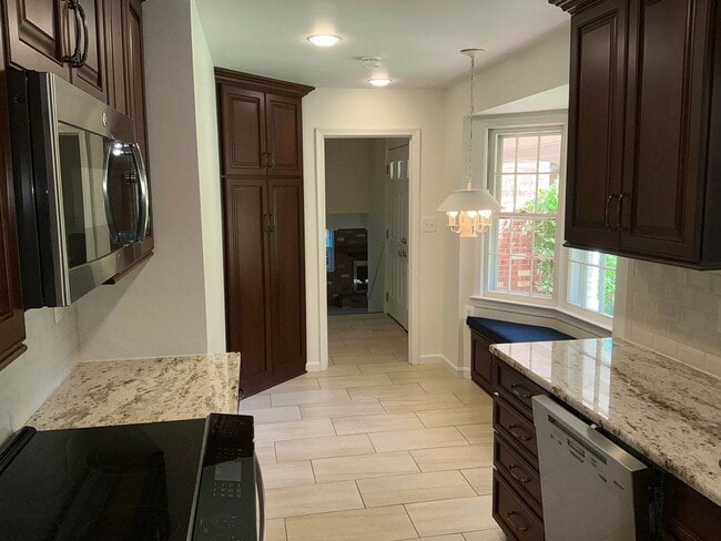Photo - Very well maintained 4BR 2.5BA 4-level split 2 car attached garage and fully fenced yard