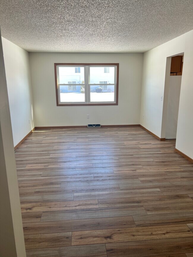Spacious living room with new floors and paint - 2362 Darwin Ln