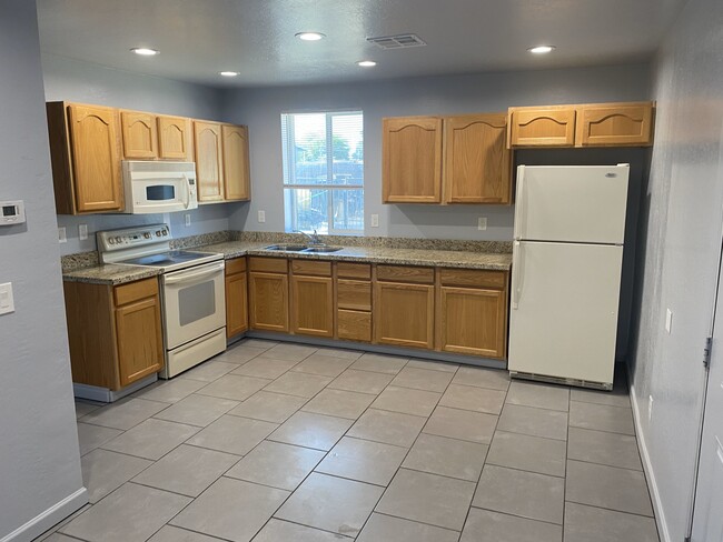 Kitchen with appliances - 215 N Pima Rd House