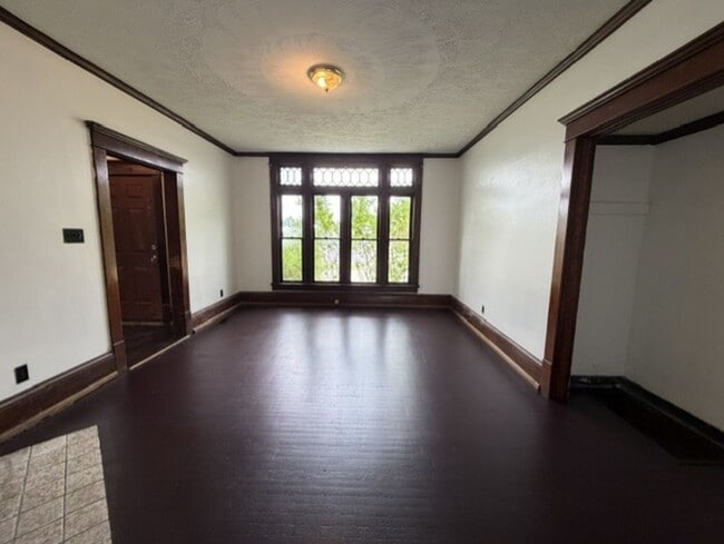 Photo - Spacious 4-Bedroom Home with 2 Full Baths, Central A/C & Fenced Yard!