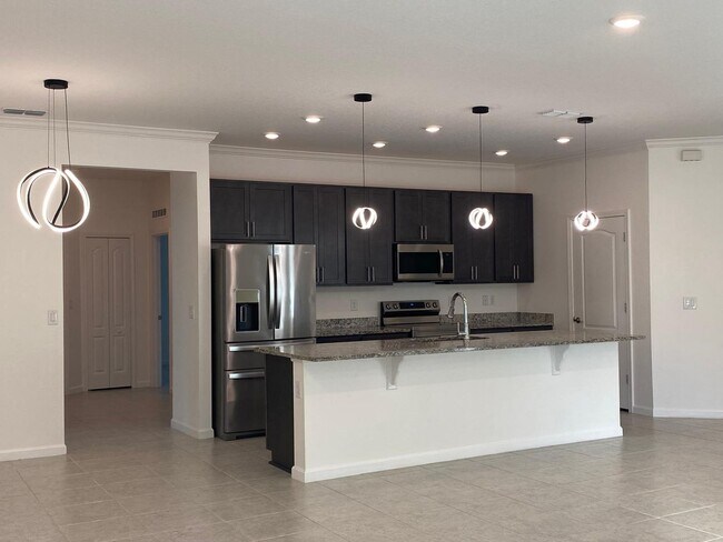 Photo - Like New 3 bedroom + den with French doors, screened in porch and Fenced yard and much more...