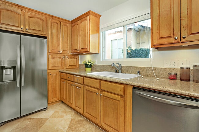 Kitchen Stainless Steel Appliances with Cheer wood cabinets - 3424 Bellevue Ave