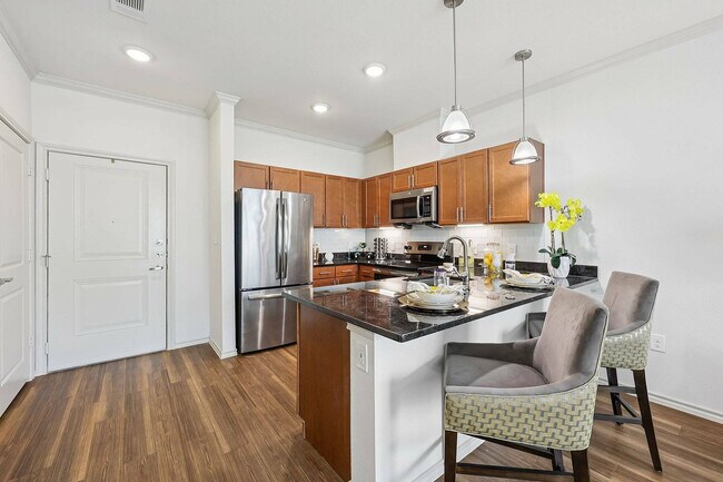 Host friends and family in style with a spacious kitchen island at McDermott 55.
