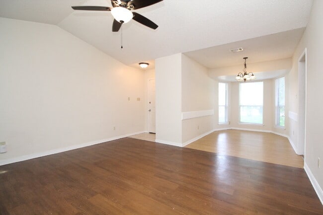 Photo - 2BR Home with Wood-Look Flooring, Fenced Backyard & Private Patio Unit D