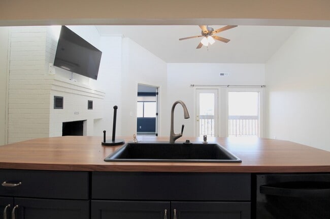 Photo - Top floor completely remodeled condo with open concept, vaulted ceilings and an electric fireplace!