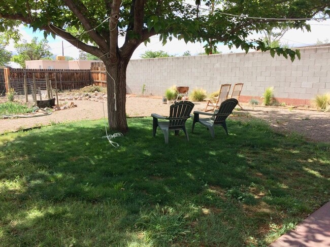 Lovely shade tree in the fully fenced backyard near the garden. - 805 Cagua Drive Southeast