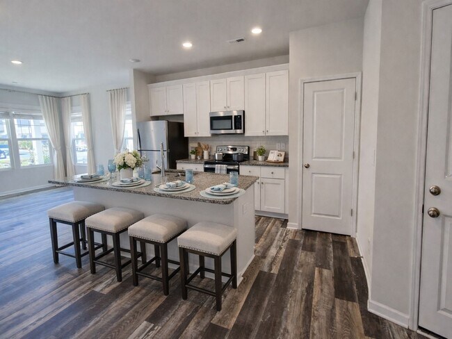 Photo - 3BR Townhome • Full Kitchen • Garage + Driveway